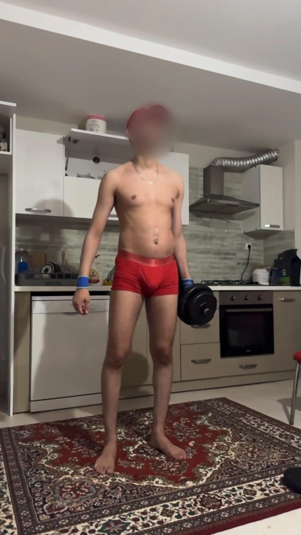 Day 98 in the same kitchen with the same dumbbell, a fuller chest and arms