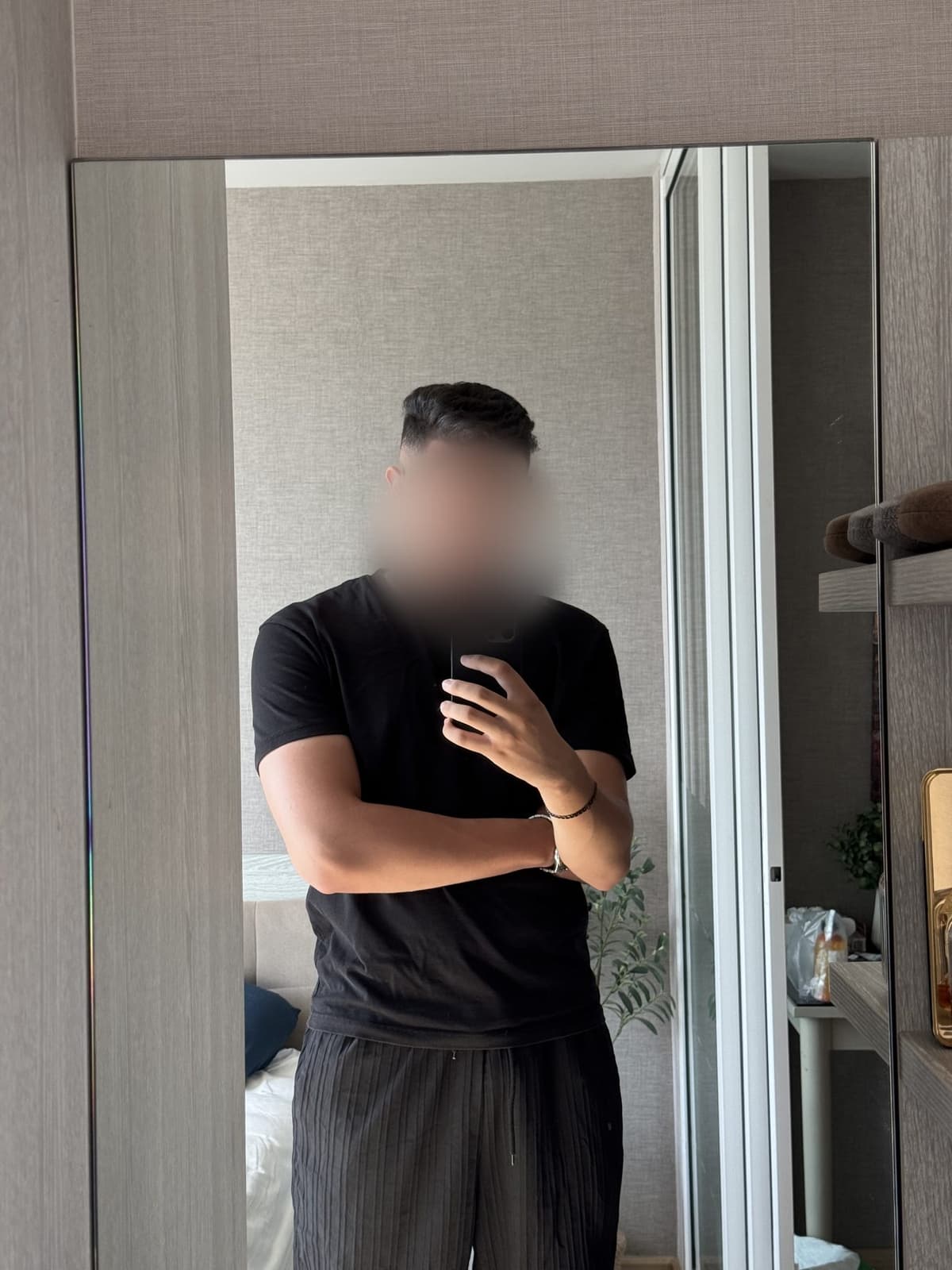 Mehdi after, a basic black t-shirt filled out at the chest and arms